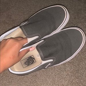 Slightly worn gray slip on vans